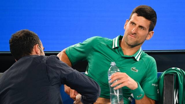 Australian Open 2021: Tournament on tenterhooks over Novak Djokovic injury as stands fall silent
