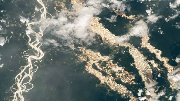 All that glitters: Golden rivers in Peruvian Amazon dazzles but mining harms the community, environment