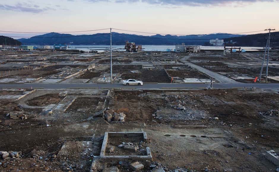 A car passes through the leveled city of Minamisanriku almost one year after the tsunami. Image via The Associated Press/David Guttenfelder A car passes through the leveled city of Minamisanriku almost one year after the tsunami. Image via The Associated Press/David Guttenfelder