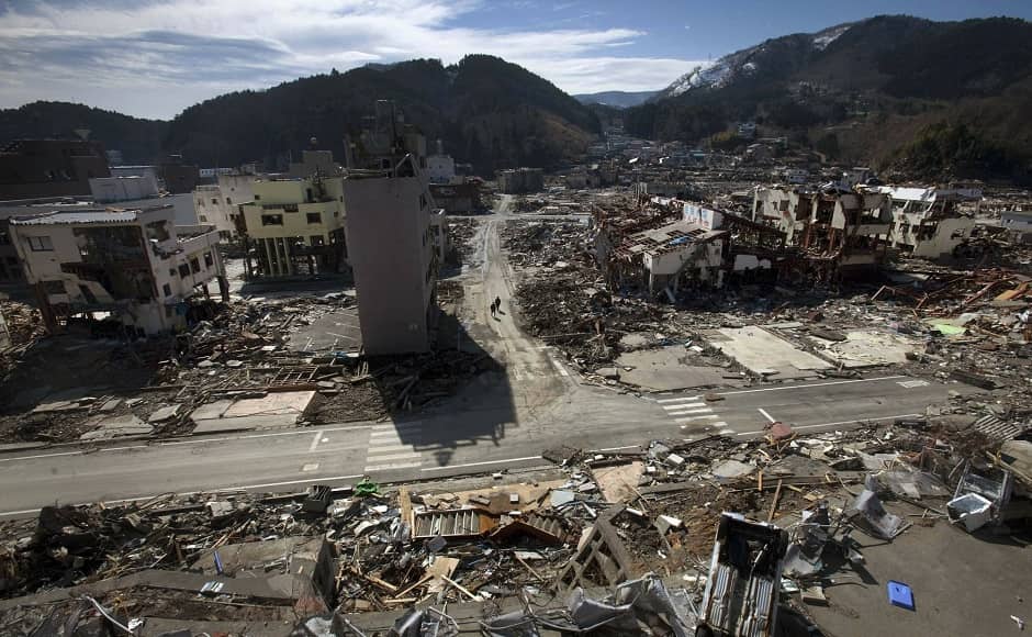 Residents of the tsunami and earthquake destroyed town of Onagawa in Miyagi Prefecture walk down an empty street on 19 March, 2011. Image via The Associated Press/David Guttenfelder Residents of the tsunami and earthquake destroyed town of Onagawa in Miyagi Prefecture walk down an empty street on 19 March, 2011. Image via The Associated Press/David Guttenfelder