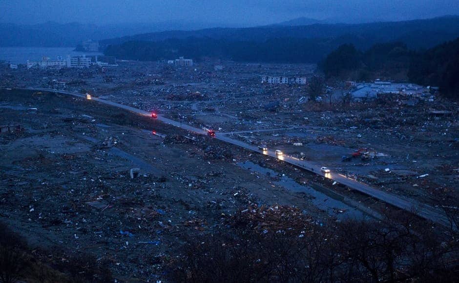 Vehicles pass through the ruins of the leveled city of Minamisanriku, Miyagi Prefecture, northeastern Japan, on 15 March, 2011, four days after the Tsunami devastated the area. Image via The Associated Press/David Guttenfelder Vehicles pass through the ruins of the leveled city of Minamisanriku, Miyagi Prefecture, northeastern Japan, on 15 March, 2011, four days after the Tsunami devastated the area. Image via The Associated Press/David Guttenfelder
