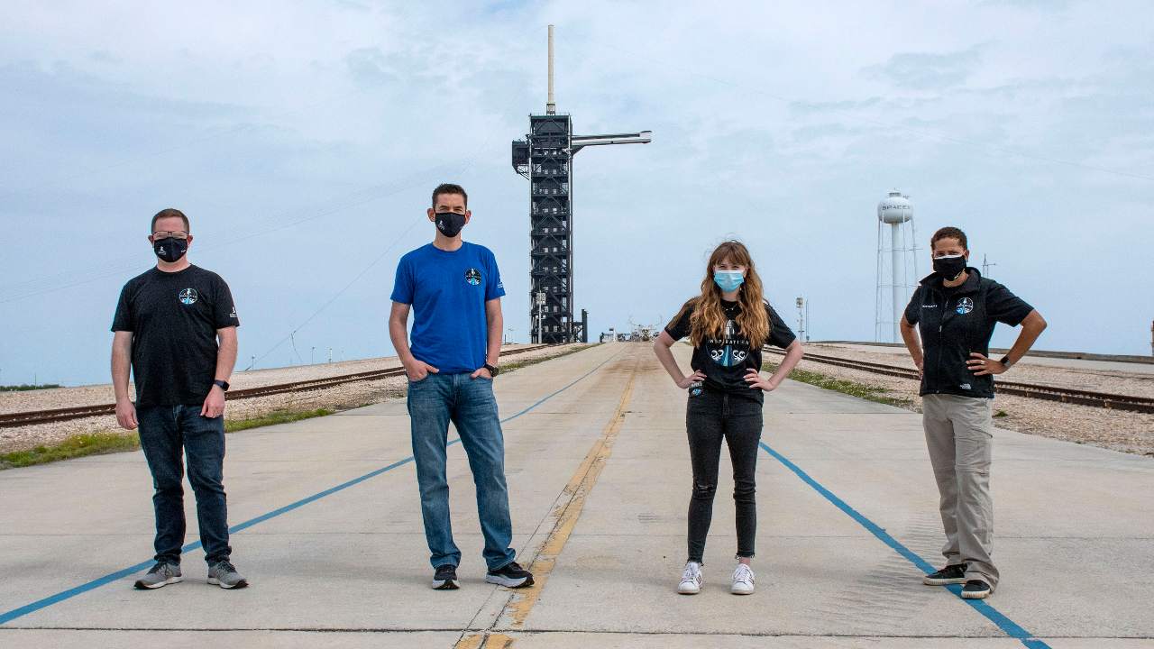 In this photo provided by SpaceX, Chris Sembroski, from left to right, Jared Isaacman, Hayley Arceneaux and Sian Proctor pose for a photo, Monday, March 29, 2021, at the SpaceX launch pad at NASA’s Kennedy Space Center at Cape Canaveral, Fla. (SpaceX via AP)