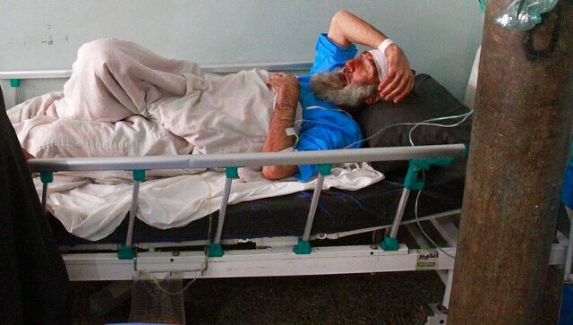 An injured man is treated at a hospital after a car bomb attack in Herat province, west of Kabul, Afghanistan. AP