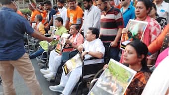 BJP protests against death of party members in Bengal, mocks Mamata Banerjee with wheelchair rally