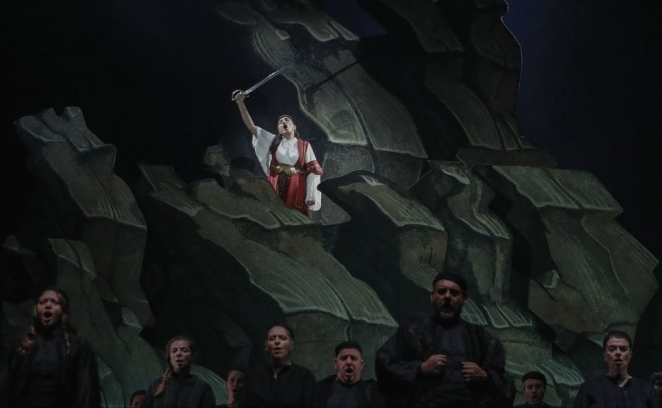 With her sword raised but defeat certain, the title character in composer Pavlos Carrer’s 1875 opera chooses death over captivity, detonating ammunition stored in a fortress as Ottoman forces close in. In the picture: Greek soprano Artemis Bogri holding a sword, sings during a rehearsal of 'Despo-Greek Dances' Opera and dance performance in Athens, on Thursday, 4 March, 2021. Photo via The Associated Press/Thanassis Stavrakis With her sword raised but defeat certain, the title character in composer Pavlos Carrer’s 1875 opera chooses death over captivity, detonating ammunition stored in a fortress as Ottoman forces close in. In the picture: Greek soprano Artemis Bogri holding a sword, sings during a rehearsal of 'Despo-Greek Dances' Opera and dance performance in Athens, on Thursday, 4 March, 2021. Photo via The Associated Press/Thanassis Stavrakis