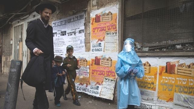 Purim celebrations in Jerusalem threaten fresh COVID-19 outbreak in Israel, disrupting its successful vaccination efforts
