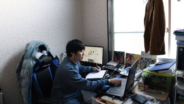 Tetsuya Akutsu, a freelance animator, at work in his apartment in Tokyo on Jan. 14, 2021. Akutsu wants to start a family, but on his wages, he says, 