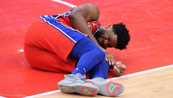 NBA: Joel Embiid injured in East-leading 76ers' victory over Wizards, Lakers rally to beat Pacers