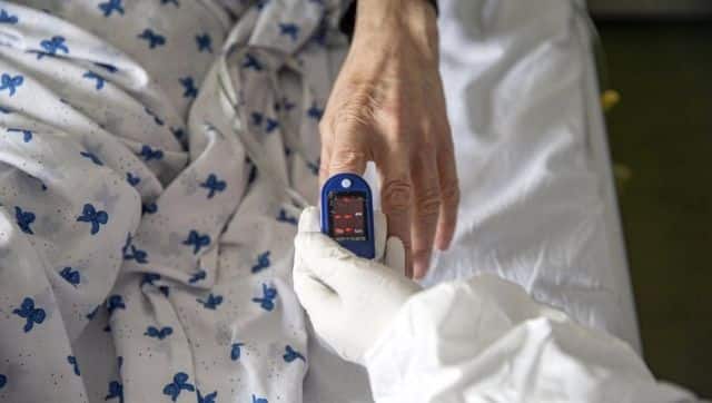  Jashari checks a patient at the Pulmonological Clinic in Kosovo's capital Pristina on 8 March. Photo via The Associated Press/Visar Kryeziu