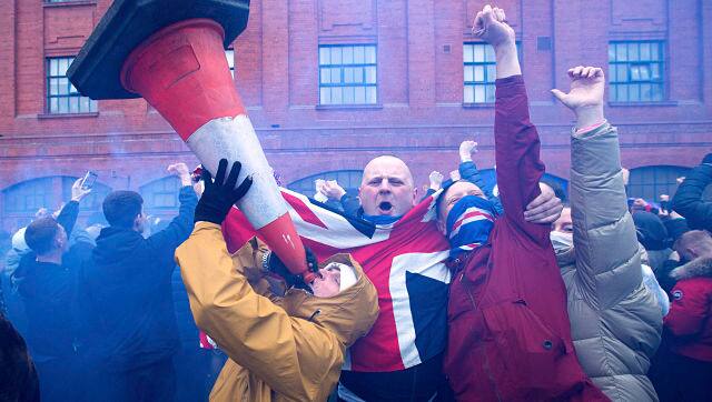 Rangers fans celebrate outside the ground after their win in the Scottish Premiership match against St Mirren on Saturday . AP Photo