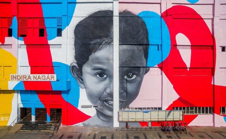 The underlying aim is to highlight art as an effective response to global crises, and a tool to deliver messages of awareness, feelings of longing or loss and ideas of hope. The mural depicts the portraits of five individuals, of which three are patients of HIV, but which cannot be determined by just visual appearances.| Photograph by Pranav Gohil. The underlying aim is to highlight art as an effective response to global crises, and a tool to deliver messages of awareness, feelings of longing or loss and ideas of hope. The mural depicts the portraits of five individuals, of which three are patients of HIV, but which cannot be determined by just visual appearances.| Photograph by Pranav Gohil.