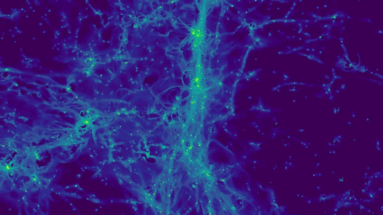 The image shows the light emitted by hydrogen atoms in the cosmic web in a region roughly 15 million light years across. In addition to the very weak emission from intergalactic gas, a number of point sources can be seen: these are galaxies in the process of forming their first stars. Image credit: CNRS/Jeremy Blaizot / projet SPHINX