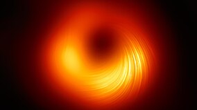 Astronomers capture image of the magnetic field around M87's black hole