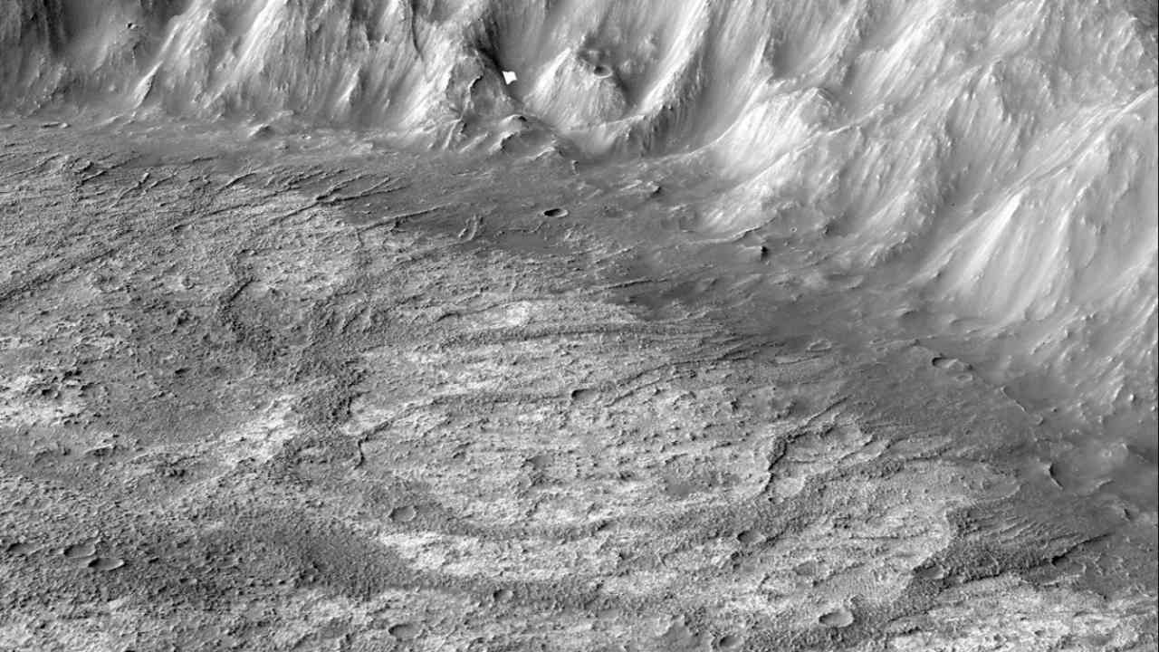 Raised ridges spidering across the floor of a Martian crater were likely created by runoff from a long-lost glacier that once draped the planet's southern highlands. Credit: NASA