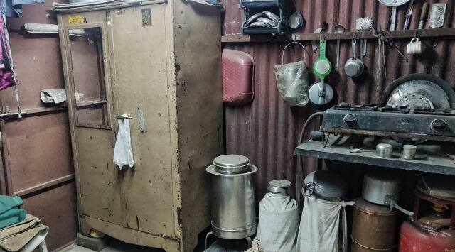 Inside Chayya Naik’s tin shanty, where she continues her tailoring work even today.