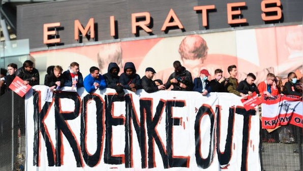 Premier League: Arsenal fans turn to devil and vampire in protests at owner Stan Kroenke