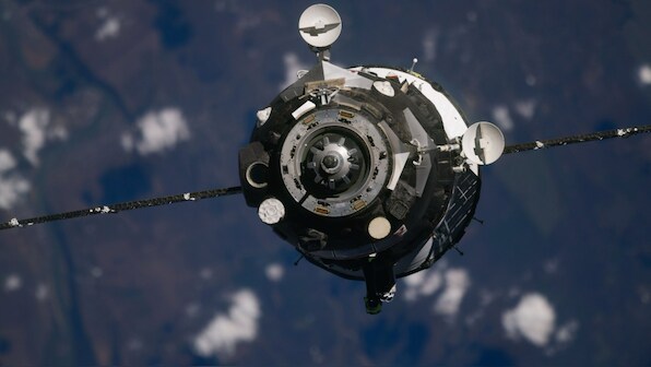 Two cosmonauts, one astronaut arrive at the International Space Station