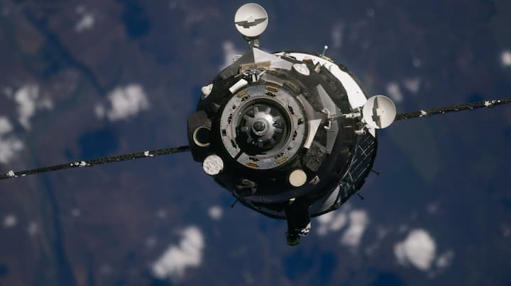 Two cosmonauts, one astronaut arrive at the International Space Station
