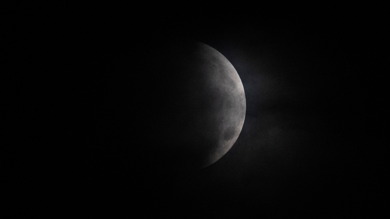 A lunar eclipse or a Chandra Grahan occurs when the moon moves into the Earth’s shadow and light from the Sun cannot fall on the moon. The moon is partially covered during a lunar eclipse over Mexico City, early Wednesday, May 26, 2021. (AP Photo/Marco Ugarte)