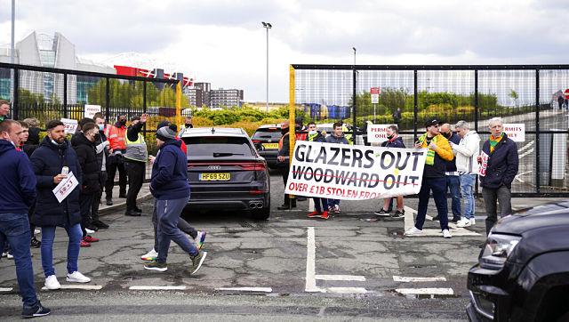Premier League: Manchester United fans' anti-Glazers protest forces postponement of Liverpool clash Premier League: Manchester United fans' anti-Glazers protest forces postponement of Liverpool clash