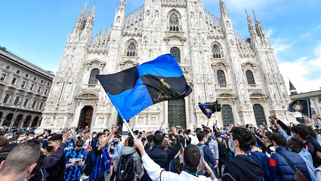 Inter Milan fans celebrate in Piazza Duomo square in front of the gothic cathedral after Inter Milan won its first Serie A title in more than a decade. AP