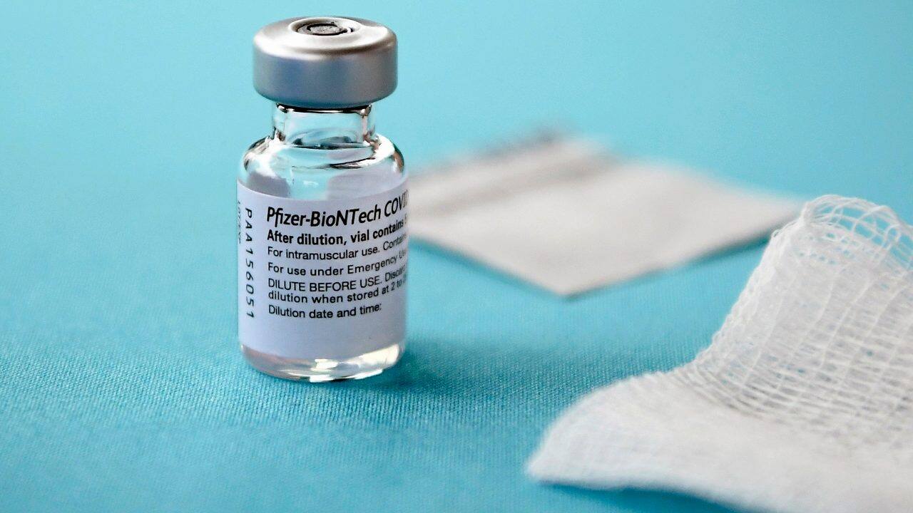 A vial of the Pfizer vaccine for COVID-19 sits on a table at Hartford Hospital in Hartford, Conn. Image credit: AP Photo/Jessica Hill
