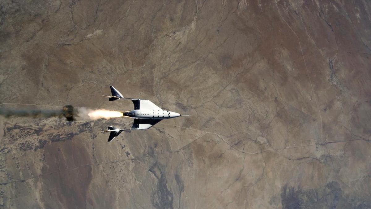 Virgin Galactic reaches edge of Earth's atmosphere for the first time with two pilots