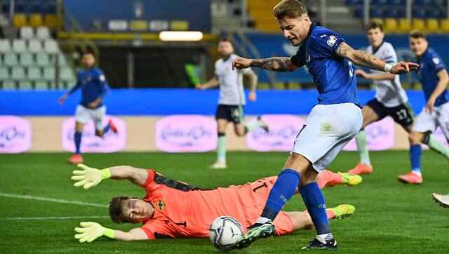 In this file photo, Italy’s Ciro Immobile, right, competes for the ball with Northern Ireland’s goalkeeper Bailey Peacock Farrell, bottom, during the World Cup 2022 qualifier game between Italy and Northern Ireland. AP
