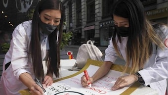 For Asian American health workers, a dual battle with COVID-19 and racism rages on
