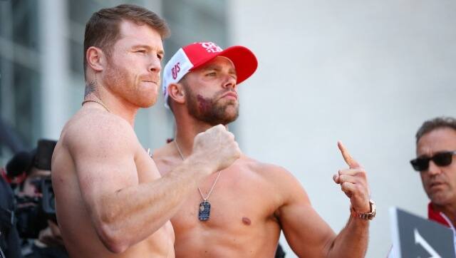 Saul 'Canelo' Alvarez (L) and Billy Joe Saunders (R) face off after weighing in. AFP