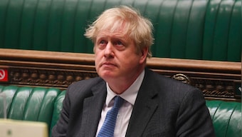 UK lawmakers back COVID curbs to rein in Omicron amid revolt by Conservative Party MPs
