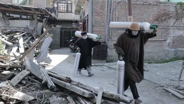 SRO workers at their office in Srinagar lifting cylinders. Image courtesy: SRO Srinagar
