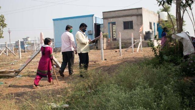 Frontline healthcare workers in Tardal village surveying the community and helping people register on CoWIN