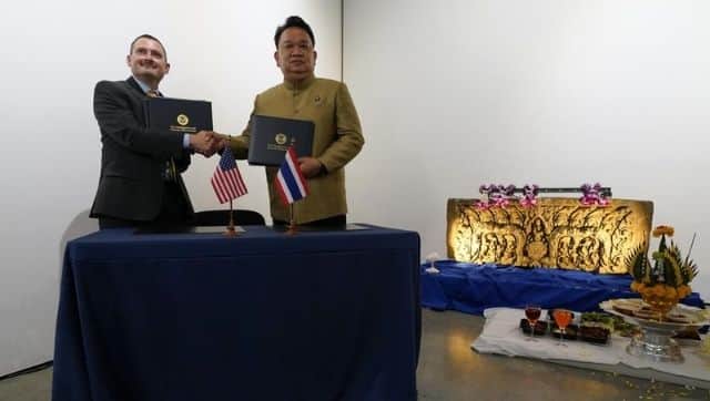 Tatum King, special agent in charge of Homeland Security Investigations in San Francisco with Mungkorn Pratoomkaew, Consul-General of Thailand in Los Angeles, during a ceremony to return two stolen hand-carved sandstone lintels back to Thailand. Image via The Associated Press/ Ashley Landis