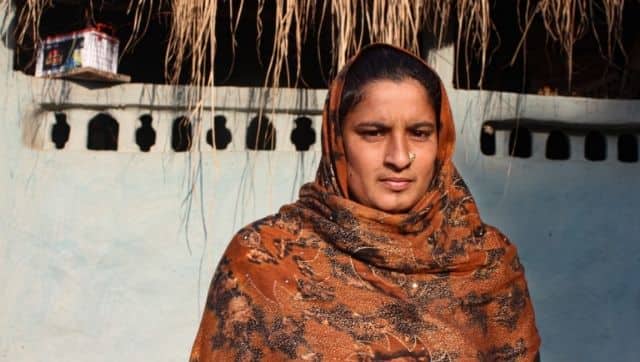 A young Van Gujjar mother of Diyawali village in the forest, is hopeful that her family will be resettled with new land so that she can send her daughter to school. Photo by Radhika Gupta.