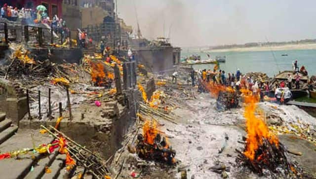 Pyres and garlands at Harishchandra Ghat in Varanasi. Firstpost/Mohammad Sartaj Alam