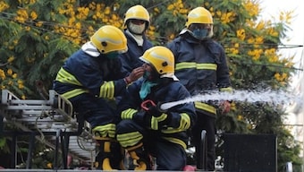 Watch: Two men risk their lives to rescue girl from burning apartment in Moscow