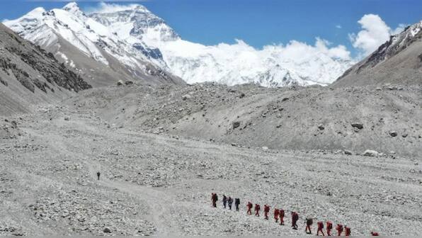 China opens Mount Everest’s north side to 38 virus-tested mountaineers