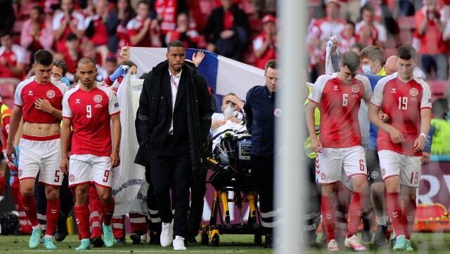 Surrounding the medical personnel trying to revive Eriksen with chest compressions was a defensive formation. AP 