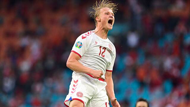 Denmark's Kasper Dolberg celebrates after scoring his side's second goal against Wales. AP