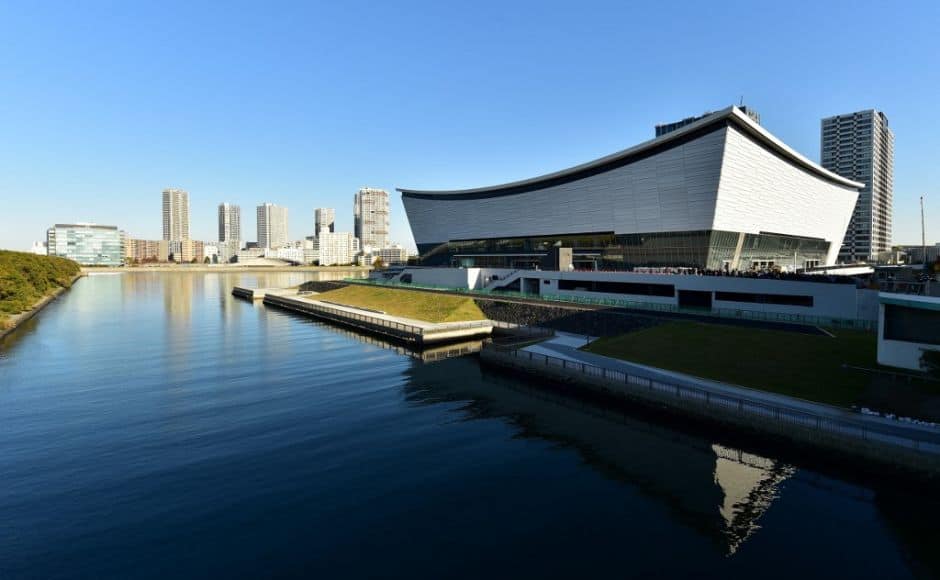 (FILES) This file photo taken on November 21, 2019 shows a general view of the construction site of the Ariake Arena (R), venue for the volleyball and wheelchair basketball competitions in the upcoming Tokyo 2020 Olympic Games and Paralympic sports events in Tokyo. - From a state-of-the-art aquatics centre to a historic martial arts arena whose roof resembles Mount Fuji, Tokyo's Olympic sites are ready for action after a year's virus delay. (Photo by Kazuhiro NOGI / AFP)