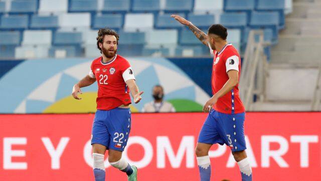 Chile's Ben Brereton, left, celebrates scoring his side's opening goal against Bolivia during a Copa America soccer match at Arena Pantanal stadium in Cuiaba, Brazil, Friday, June 18, 2021. (AP Photo/Andre Penner)