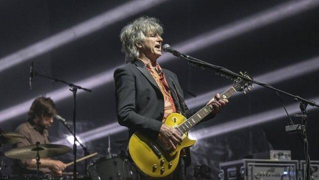Neil Finn performing at a concert in Auckland. Image via The Associated Press/ Crowded House