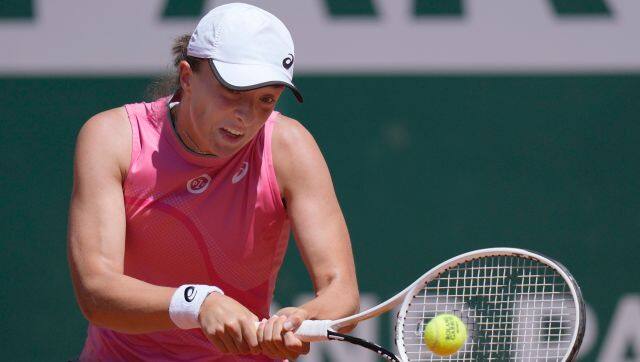Poland's Iga Swiatek plays a return to Slovenia's Kaja Juvan during their first round match on day two of the French Open tennis tournament at Roland Garros in Paris, France, Monday, May 31, 2021. (AP Photo/Thibault Camus)