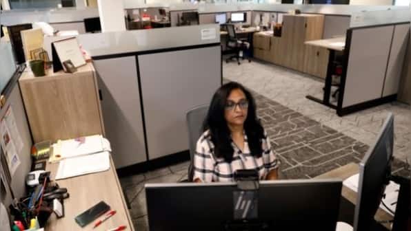 As people return to offices, companies rethink workspace layouts with wider hallways, fewer desks