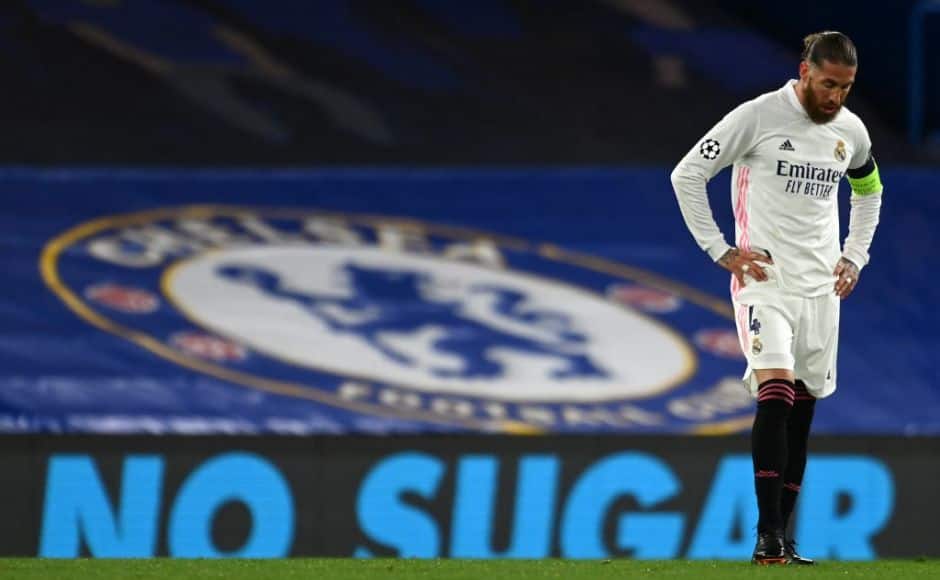 Real Madrid's Spanish defender Sergio Ramos reacts after conceding a second goal during the UEFA Champions League second leg semi-final football match between Chelsea and Real Madrid at Stamford Bridge in London on May 5, 2021. - Chelsea won the match 2-0. (Photo by Glyn KIRK / AFP)