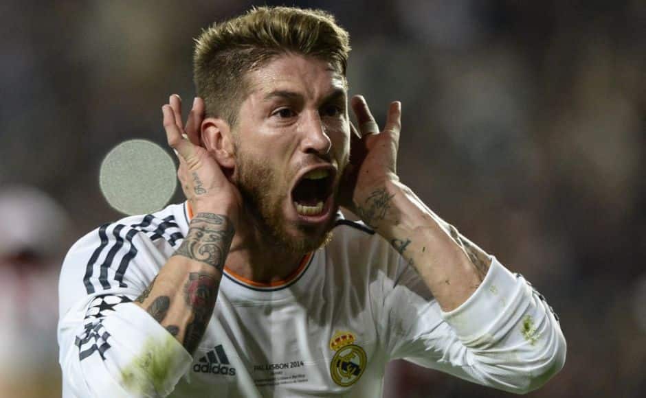 Real Madrid's defender Sergio Ramos celebrates after scoring during the UEFA Champions League Final Real Madrid vs Atletico de Madrid at Luz stadium in Lisbon, on May 24, 2014. AFP PHOTO/ FRANCK FIFE (Photo by Franck FIFE / AFP)