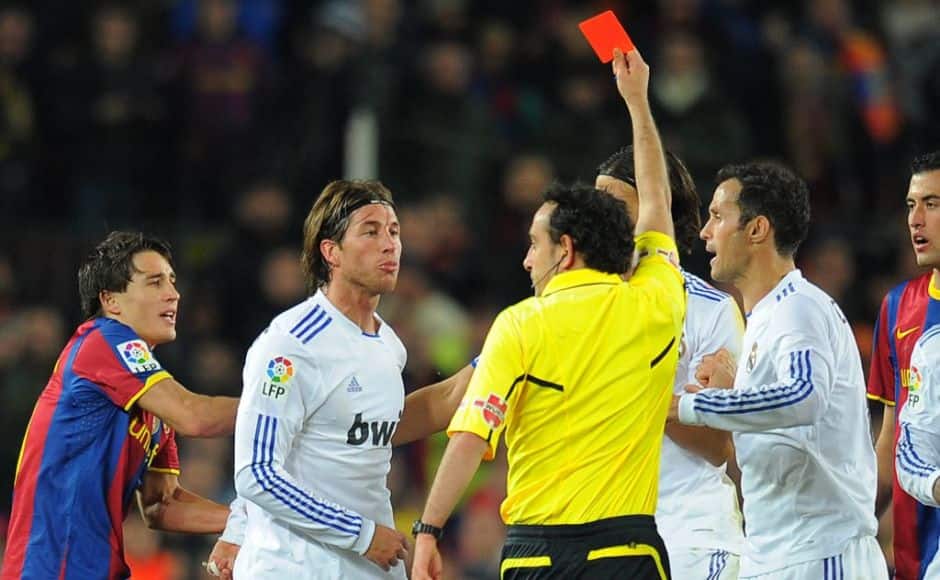 The referee shows a red card to Real Madrid's defender Sergio Ramos (2ndL) during the Spanish league 