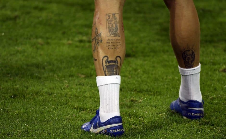 The leg of Real Madrid's Spanish defender Sergio Ramos shows a tattoo of the Champions League trophy during the training session on the eve of the UEFA Champions League group B football match Borussia Moenchengladbach v Real Madrid in Moenchengladbach, western Germany on October 26, 2020. (Photo by Ina FASSBENDER / AFP)