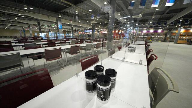 The two-floored dining area will have plastic panels to separate diners. Previous Olympics have used largely self-service, but food in Tokyo will be handled only by cooks and servers. Officials say diners can choose from about 700 options. AP Photo
